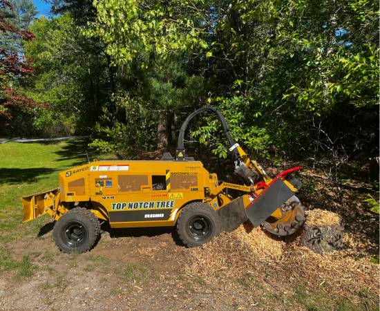 A Top Notch Tree stump grinding machine used to grind an existing stump in a client's yard.