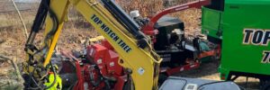 Top Notch Tree crane truck, chipper, and professional tree removal equipment positioned for a residential tree service job